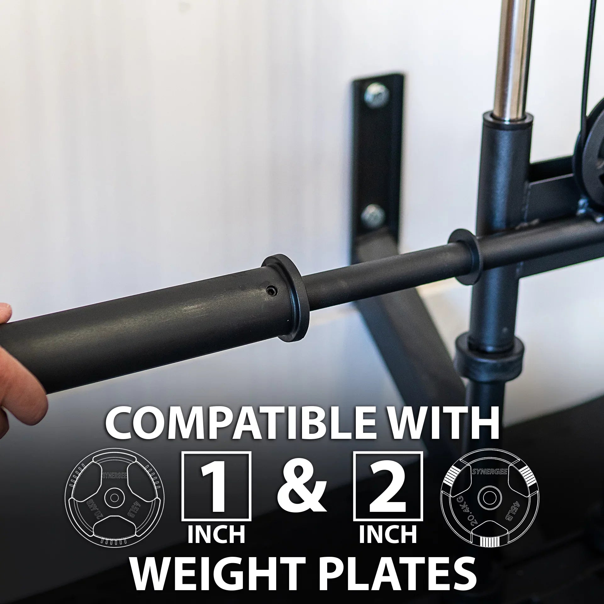 Synergee Wall Mounted Adjustable Dual Pulley Machine. Home Cable Attachment Station for Pulley System. For 1” and 2” Opening Weight Plates. Includes 2 Nylon Handles and Universal Attachment Points.